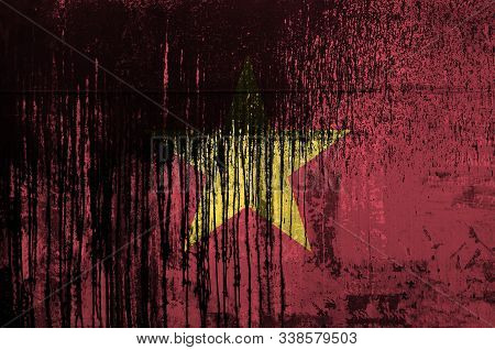 Vietnam Flag Depicted In Paint Colors On Old And Dirty Oil Barrel Wall Closeup. Textured Banner On R