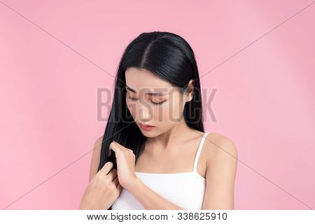 Young Woman Is Dissatisfied With The State Of Their Hair