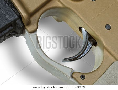 White Background With Shadow And The Trigger Of An Ar-15