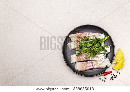 Raw Pollock (pollachius Virens) Pieces. Fresh Fish For Healthy Food Lifestyle. Lemon, Parsley, Sea S