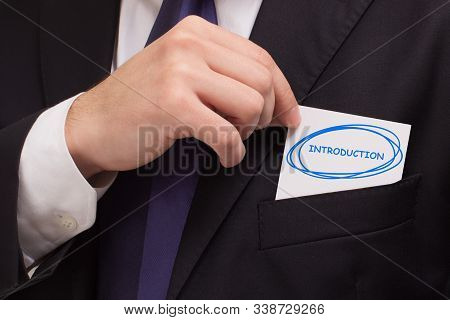 Business, Technology, Internet And Networking Concept. Young Entrepreneur Showing Keyword: Introduct