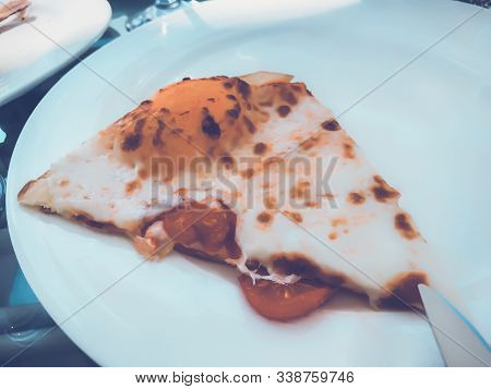 Restaurant On The Pier. A Piece Of Pepperoni Pepper On A Plate