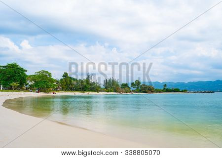 People/ Tourists/ Locals Enjoying Beautiful Morning On Tropical Caribbean Island White Sand Beach. S