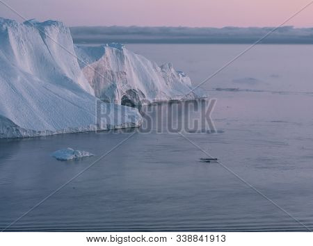 3 Humpback Whale Dive Near Ilulissat Among Icebergs During Pink Midnight Sun. Sunrise And Sunset. Th