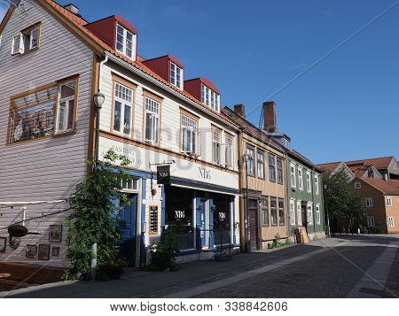 Trondheim, Norway On July 2019: Quiet Narrow Street Withbeauty Colorful Wooden Houses In European Ni