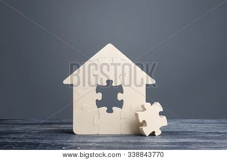 Puzzle House With A Missing Piece. The Acquisition Or Construction Comfortable Dream Home. Mortgage 