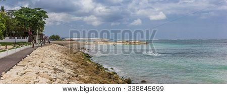 Panorama Of A Dike Along The Beach Of Seminyak On Bali, Indonesia