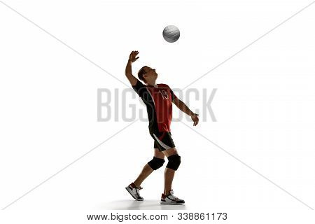 Young Caucasian Volleyball Player Placticing Isolated On White Background. Male Sportsman Training W