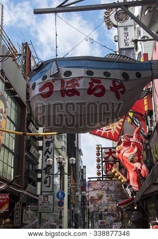 Osaka, Japan- 03 Dec, 2019: Puffer Fish Shop And Many Logo Of Other Restaurant In Dotonburi, Osaka.