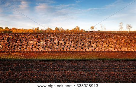 Rows Of Cutted Peat At An Excavation Side In A Peat Bog At Northwestern Germany
