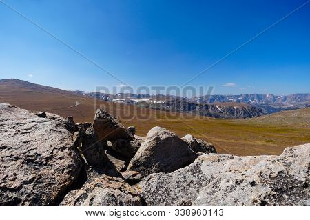 The Expansive View From The Top Of Beartooth Pass. You Can See The Beartooth Highway Going Down On T