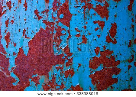 Oxidized Iron Wall With Rust And Peeled Off Blue Paint