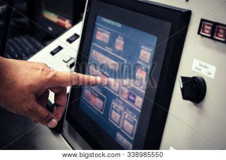 Technician Or Engineer Working On Control Panel Of Modern And Automatic High Technology Dynamometer 