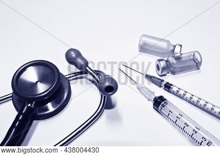 Stethoscope, Vial Of Drug, 3 And 1 Ml Plastic Syringe With Needle Isolated On The White Background