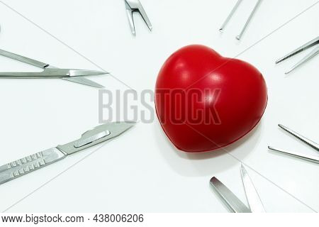 Heart And Surgical Instruments Isolated On The White Background