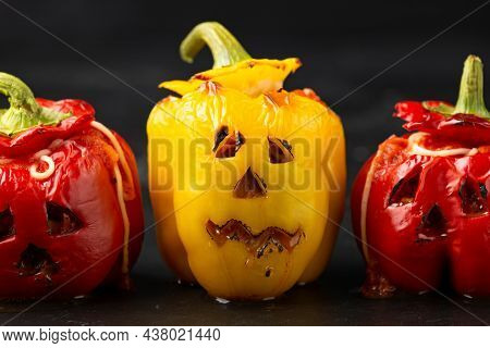 Jack O Lanterns Stuffed Yellow And Red Pepper For Halloween.