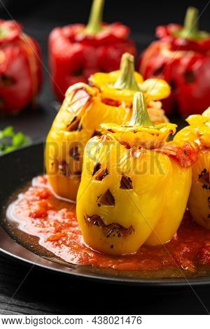 Jack O Lanterns Stuffed Yellow Pepper For Halloween.