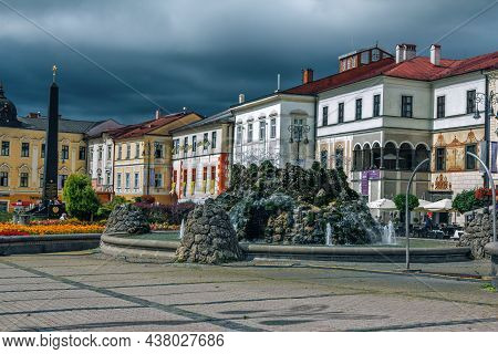 Banska Bystrica, Slovakia - August 15, 2021: View Of Snp Square - Colorful Historic Buildings, Fount