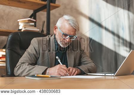 Bureaucratic Documents. Senior Man Signs A Will At The Table. Notary At Work.