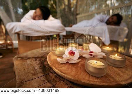 Aroma Massage For Couple At Spa Resort. Couple Lying On Massage Tables During Day-spa And Romantic W