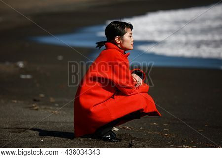 Image Of A Woman Depressed On The Beach