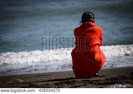 Image Of A Woman Depressed On The Beach