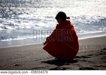 Image Of A Woman Depressed On The Beach