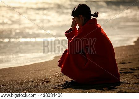 Image Of A Woman Depressed On The Beach
