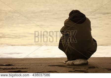 Image Of A Man Depressed In The Sea