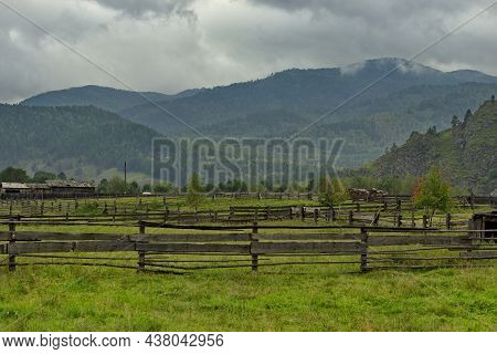 Russia. Transbaikalia, Chita Region. A Wooden Fence Made Of Boards And Poles, Which Enclose Pastures