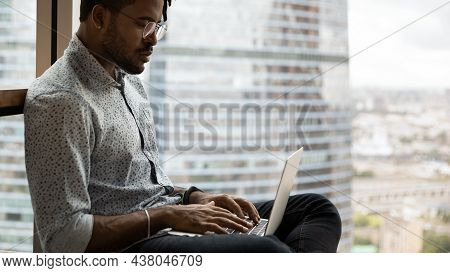 Happy Creative African Hipster Man Working On Computer.