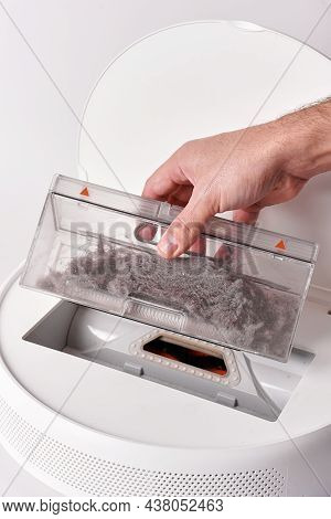 Take Out The Transparent Dust Container From The Robot Vacuum Cleaner After Cleaning The House. The