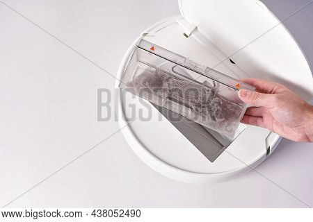 Take Out The Transparent Dust Container From The Robot Vacuum Cleaner After Cleaning The House. The