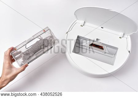 Take Out The Transparent Dust Container From The Robot Vacuum Cleaner After Cleaning The House. The