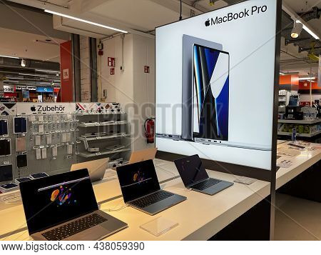 Cologne, Germany - October 01st 2021: A German Photographer Comparing And Testing The New Macbook Pr