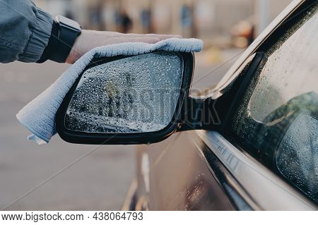 Professional Car Wash. Hand Of Man Washing Car Side Rear View Mirror With Microfiber Cloth Rag, Wipi