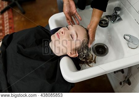 Woman getting a hair wash at a beauty salon
