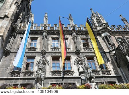 Three Large Flags On The City Hall Of Munich Symbolizing The Colors Of The City Of The Region Of Bav