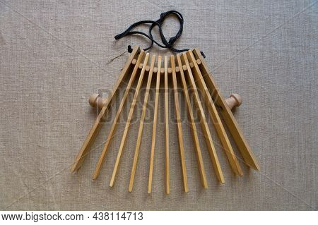 Slavic Folk Wooden Noise Musical Instrument - Rattle (treshchotka) - Lies On Gray Linen Art Canvas