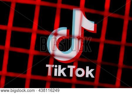 Kazan, Russia - Oct 31, 2021: The Logo Of The Social Network Tiktok Behind Bars. The Concept Of Tikt