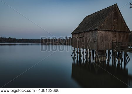 A Long Exposure From A Lake With A Old Fisherman House.
