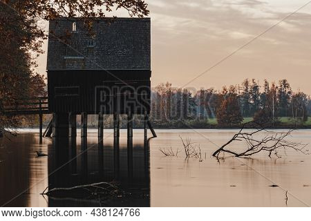 A Long Exposure From A Lake With A Old Fisherman House.