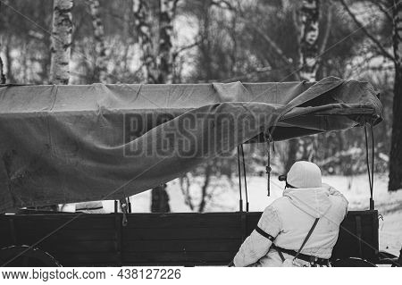 Hidden Re-enactor Dressed As German Wehrmacht Infantry Soldier In World War Ii Sitting In Ambush Nea