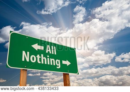 All of Nothing Green Road Sign Over Dramatic Clouds and Sky.