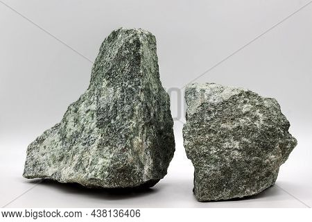 Two Fragments Of Stone, Jadeite On A Light Gray Background