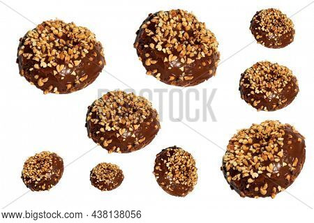 chocolate Donut with peanuts. isolated on white. room for text. clipping path. People world wide enjoy donuts. Enjoy a Donut today. Many different sized donuts.