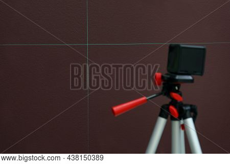 Cross Lines Of Laser Level On Brown Wall