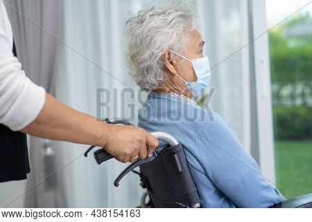 Help Asian Senior Or Elderly Old Lady Woman Sitting On Wheelchair And Wearing A Face Mask For Protec
