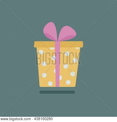 Polka Dot Gift Box With Pink Ribbon On A Green Background