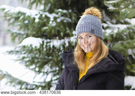 Portrait Beautiful Happy Girl Whitework Smile Teeth, Blue Eyes On Spruce Background In Frosty Day. A